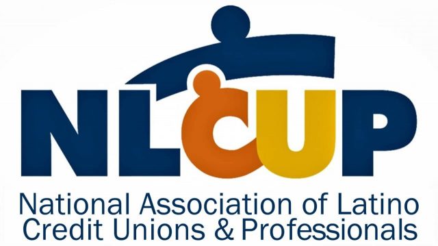Latino credit union professionals collaborating at a leadership event