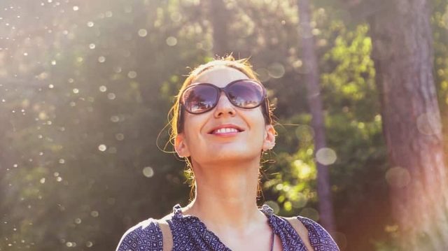 bigstock-Beautiful-Woman-Smiling-In-Nat-312502063